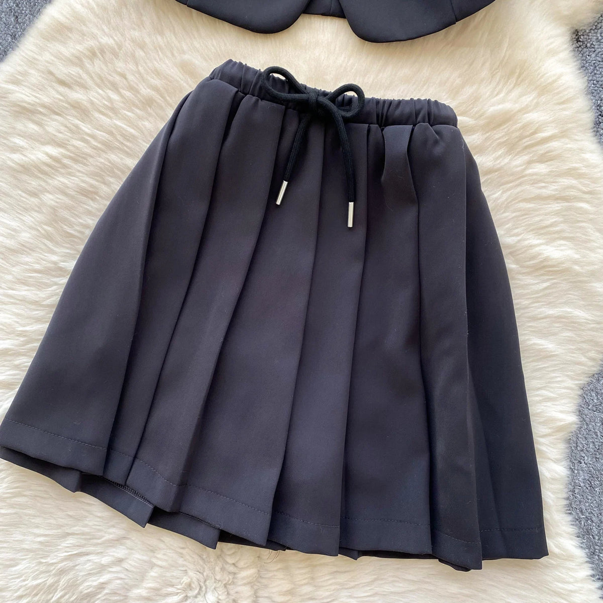 Chic Sleeveless Top & Pleated Mini Skirt Set