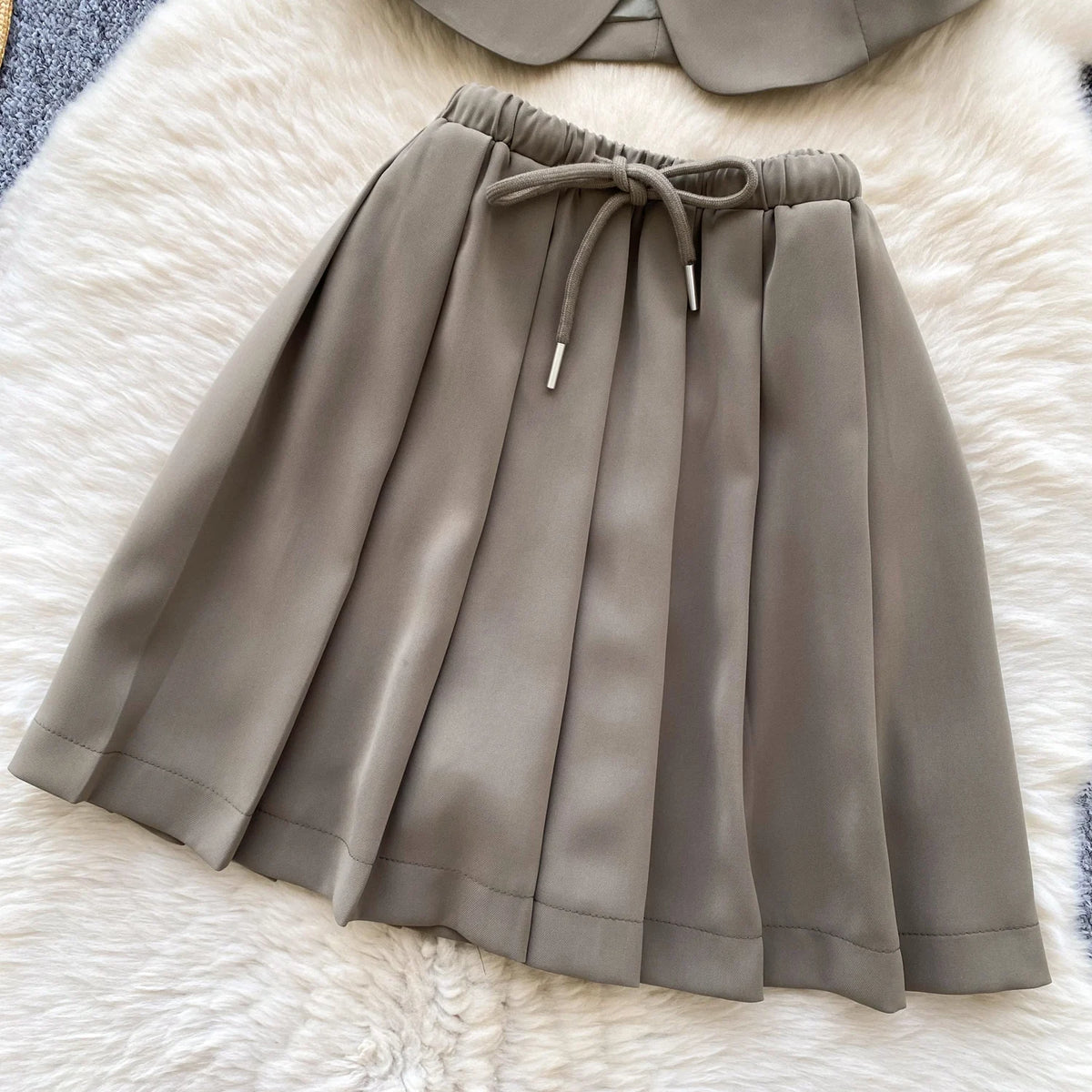 Chic Sleeveless Top & Pleated Mini Skirt Set