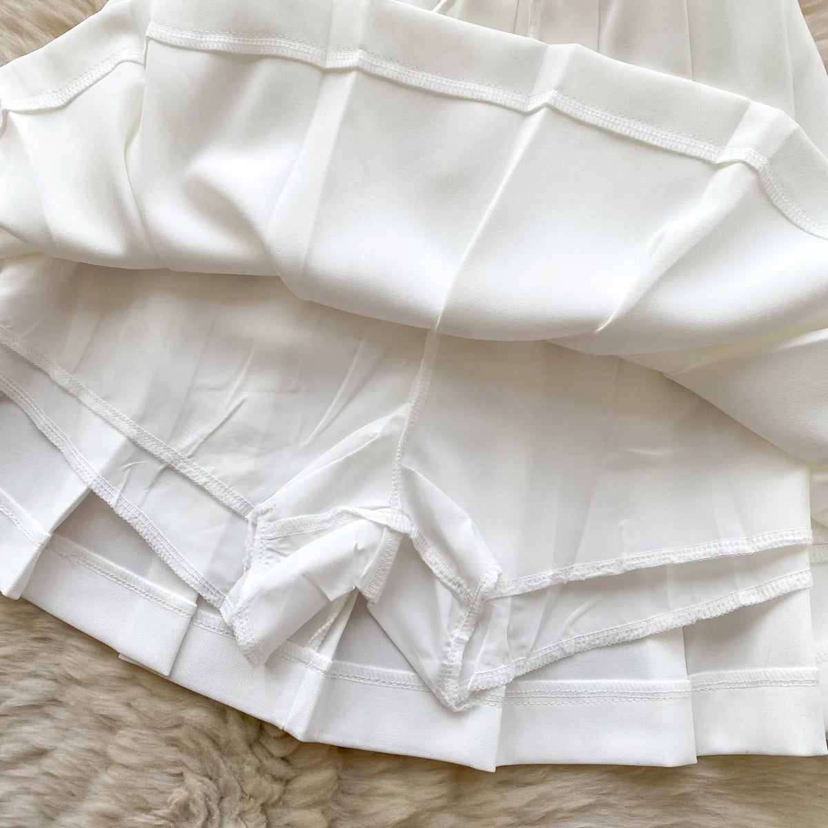 Chic Sleeveless Top & Pleated Mini Skirt Set